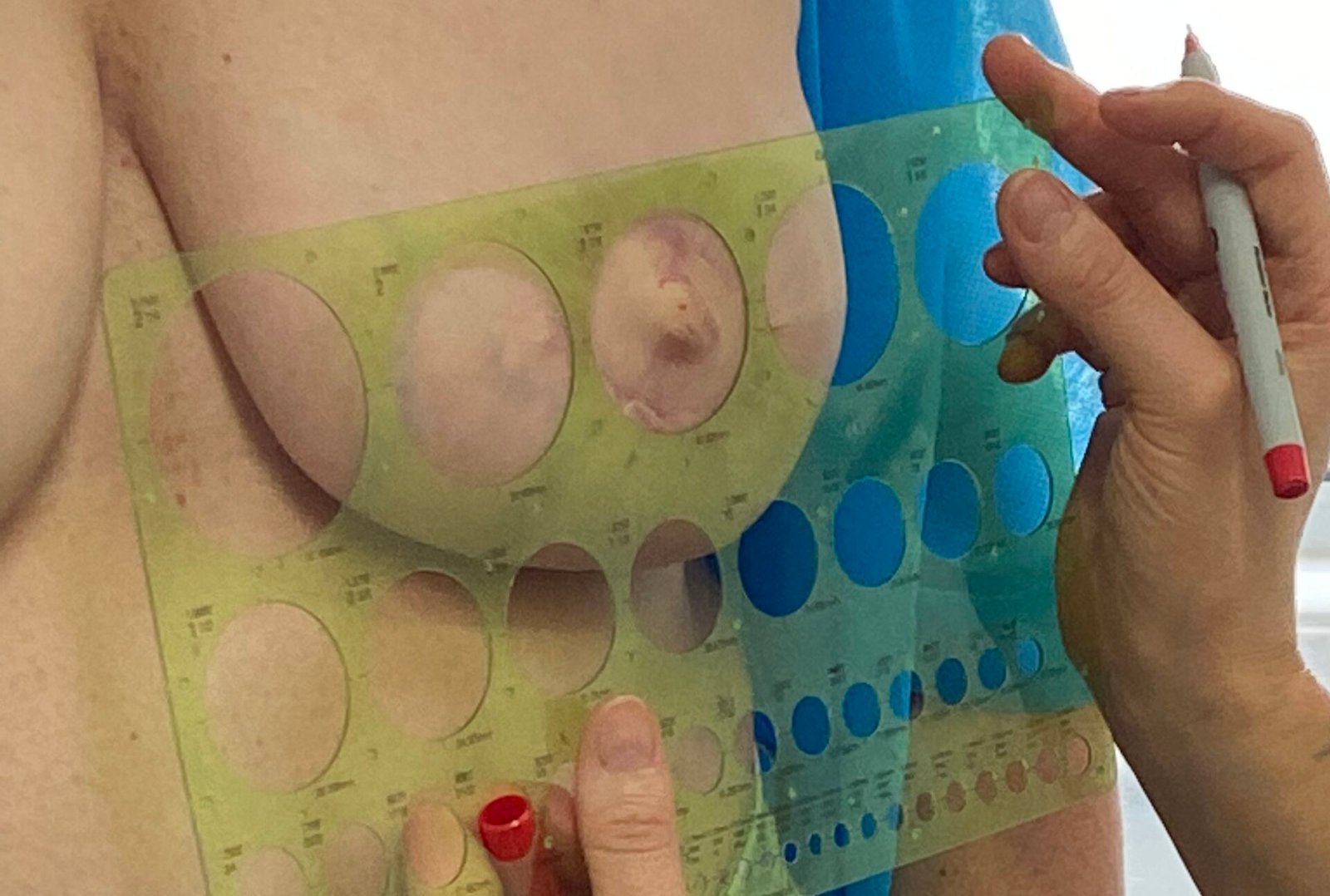 Skarlet Leon checking measurements before nipple tattoo Bournemouth